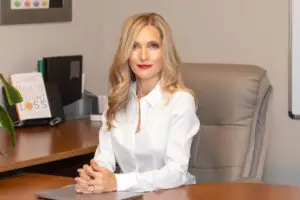 Image of our personal trainer, Lilia Anteau who is trained in all aspects of personal, group training and nutrition about to teach her students the fundamentals of nutrition.